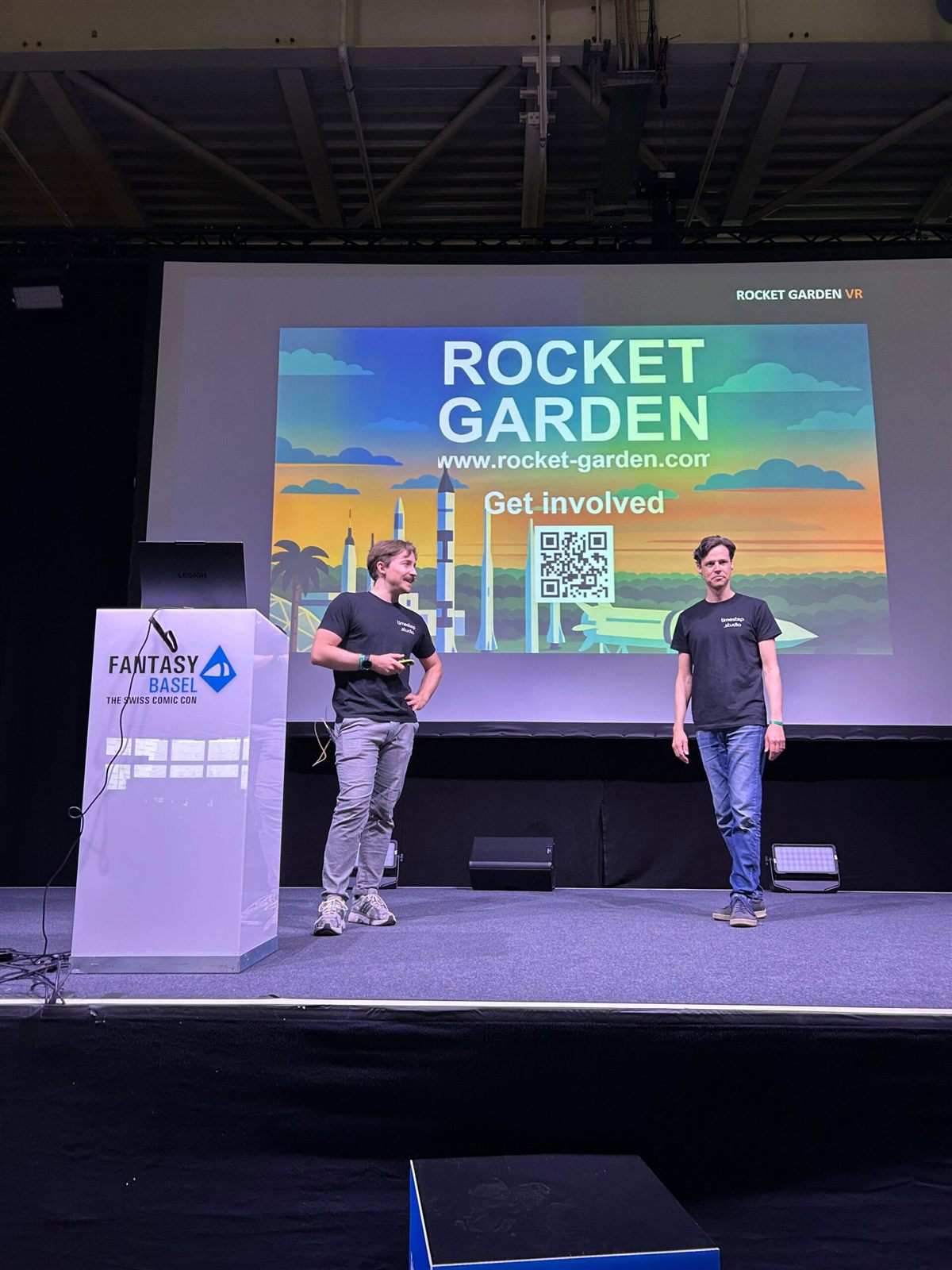 Christian and Marc on stage at Fantasy Basel, presenting Rocket Garden on a large screen.